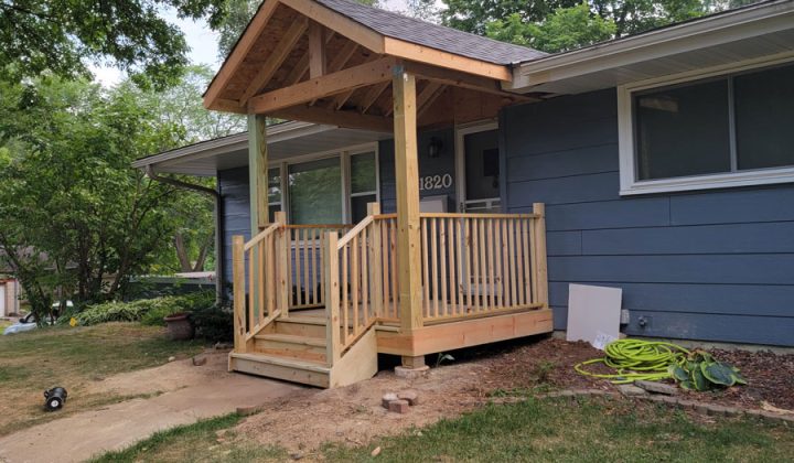ongoing built of a front porch steps and railings of a house
