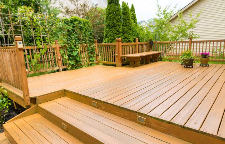 wooden deck at the backyard of a family home with landscape